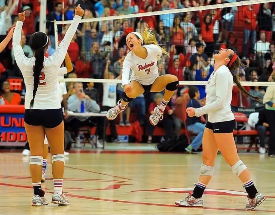 Skylar Dykstra celebrating a point during a high school volleyball match