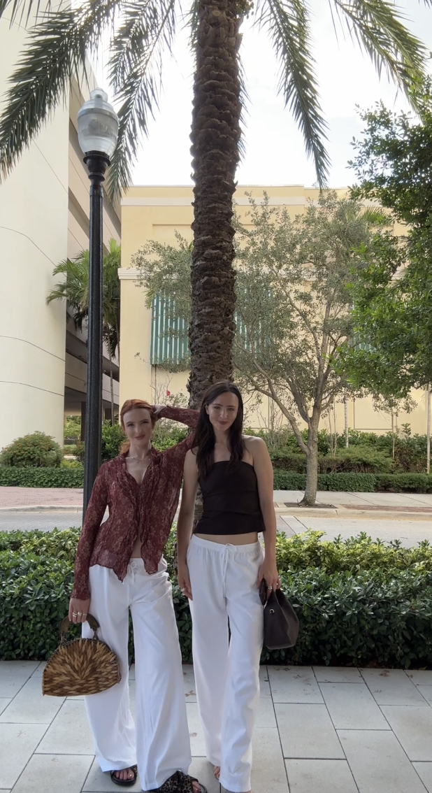 Lara and Skylar Dykstra standing together on a street in West Palm Beach
